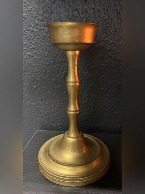 Brass Candle Holder classic baluster-style stem and a stepped round base.
